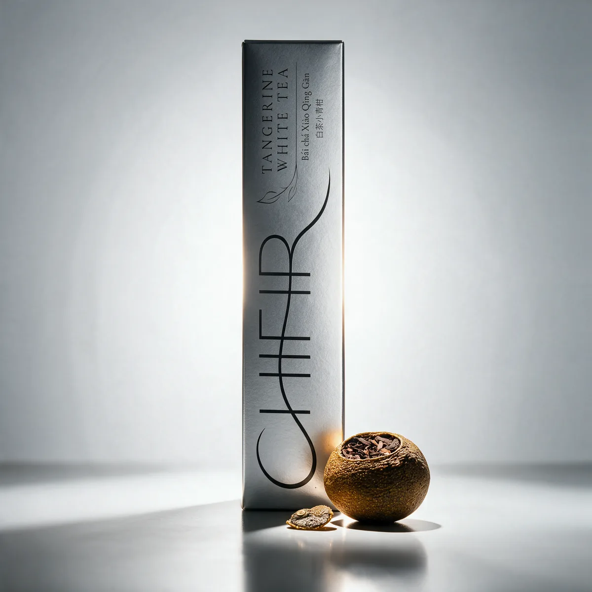 The silver Tangerine White carton with one dried tangerine piece.
